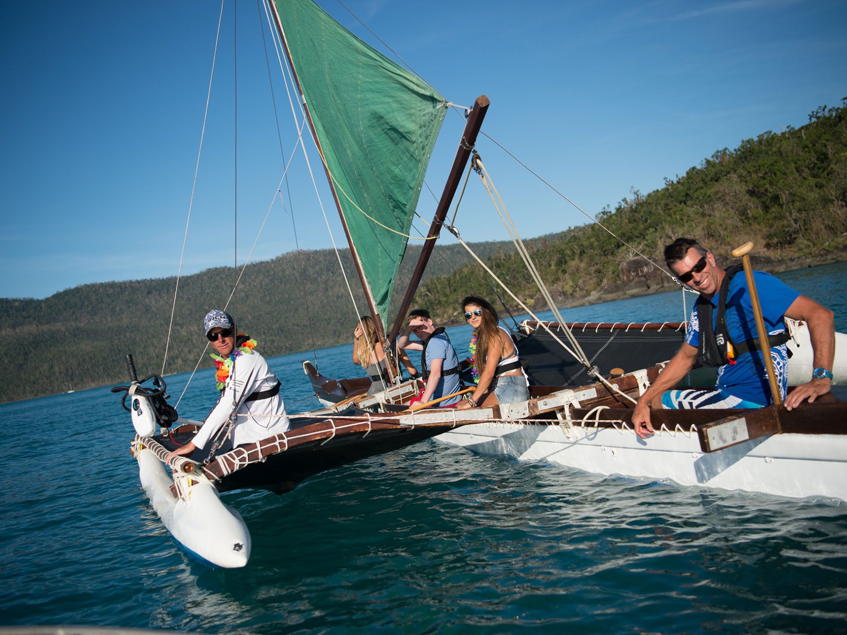 a group of people riding on the back of a ohana